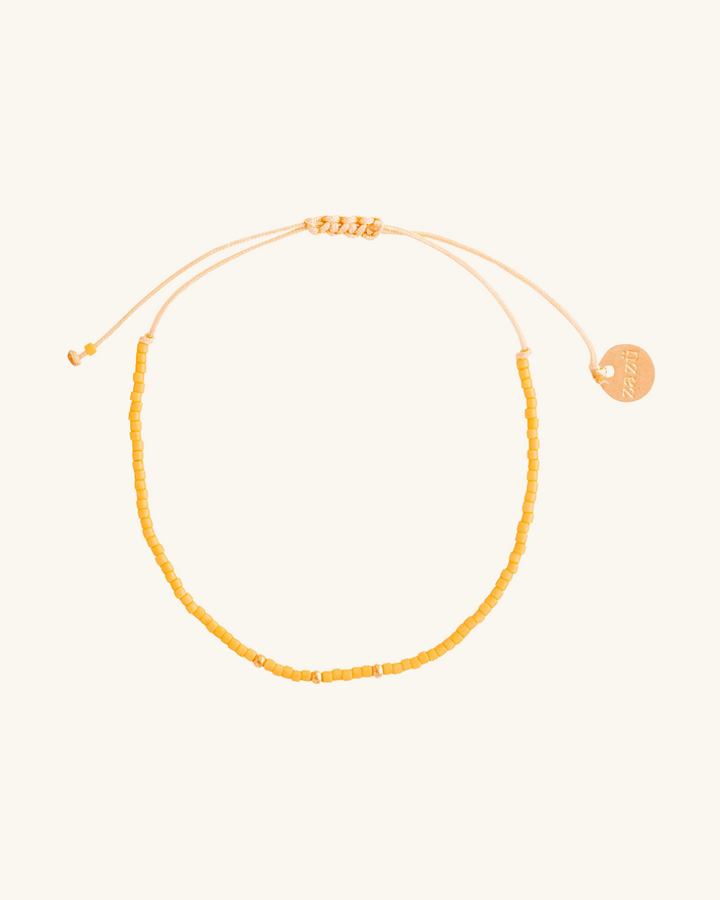 Pulsera Amarilla con Mostacillas Bañadas en Oro