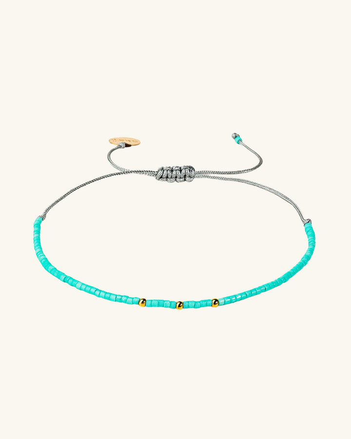 Pulsera Celeste con Mostacillas Bañadas en Oro