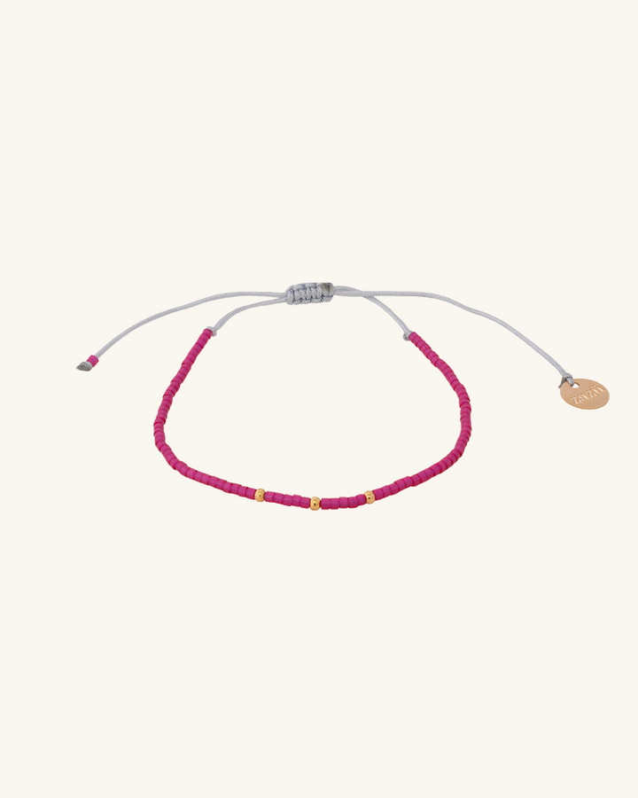 Pulsera Fucsia con Mostacillas Bañadas en Oro