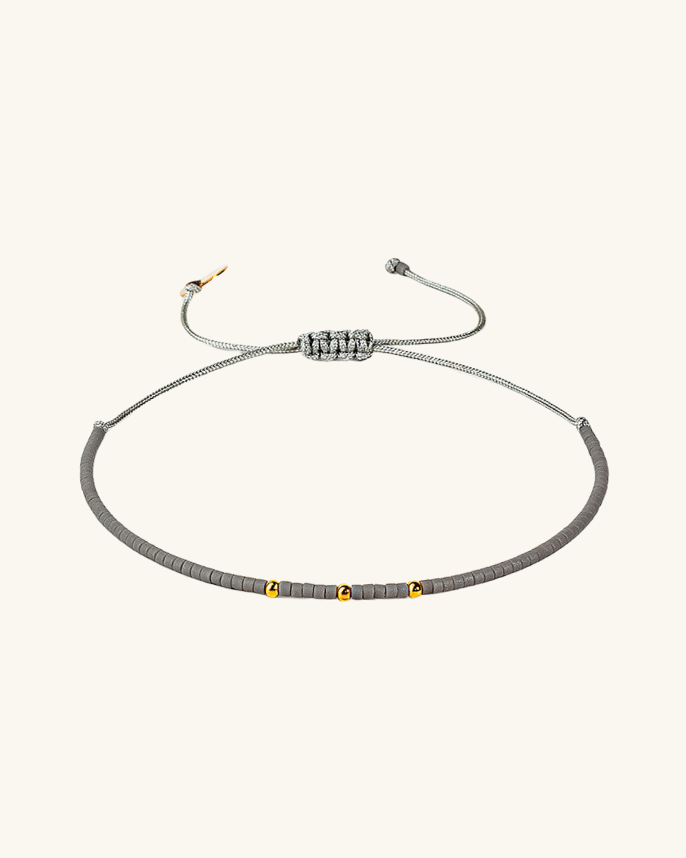 Pulsera Gris Claro con Mostacillas de Plata Bañada en Oro