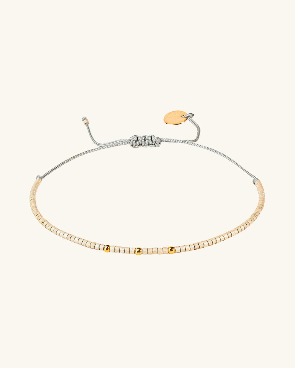Pulsera Marfil con mostacillas bañadas en oro