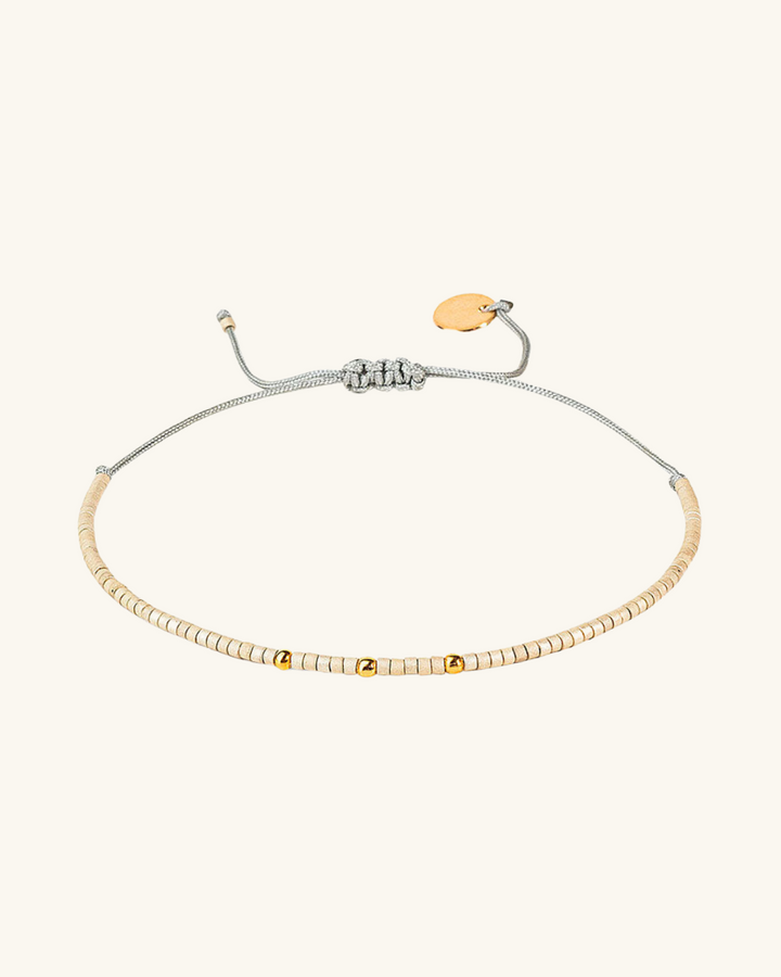 Pulsera Marfil con mostacillas bañadas en oro
