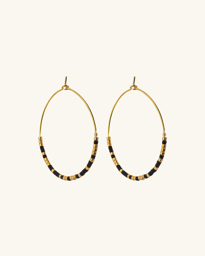 Argollas bañadas en oro con negro y dorado - Zazü