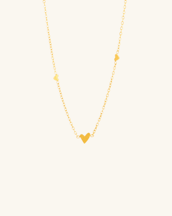 Collar con Corazoncitos de Acero Bañados en Oro
