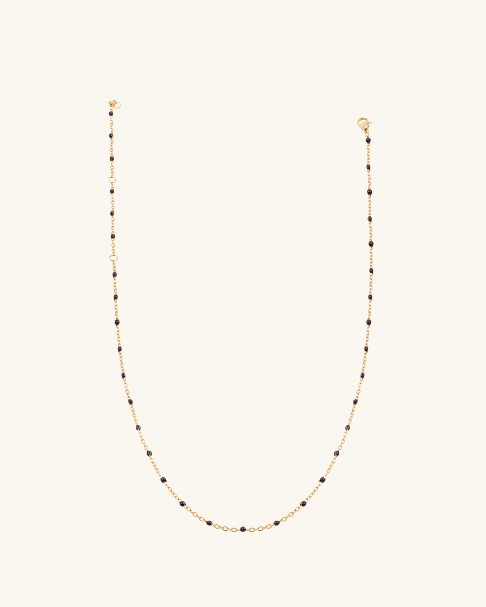 Collar Tama Negro de Acero Bañado en Oro