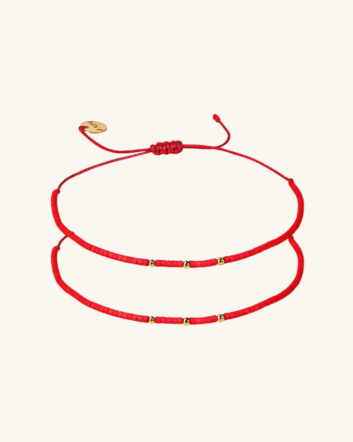 Pack 2 Pulseras Rojas con Mostacillas Bañadas en Oro