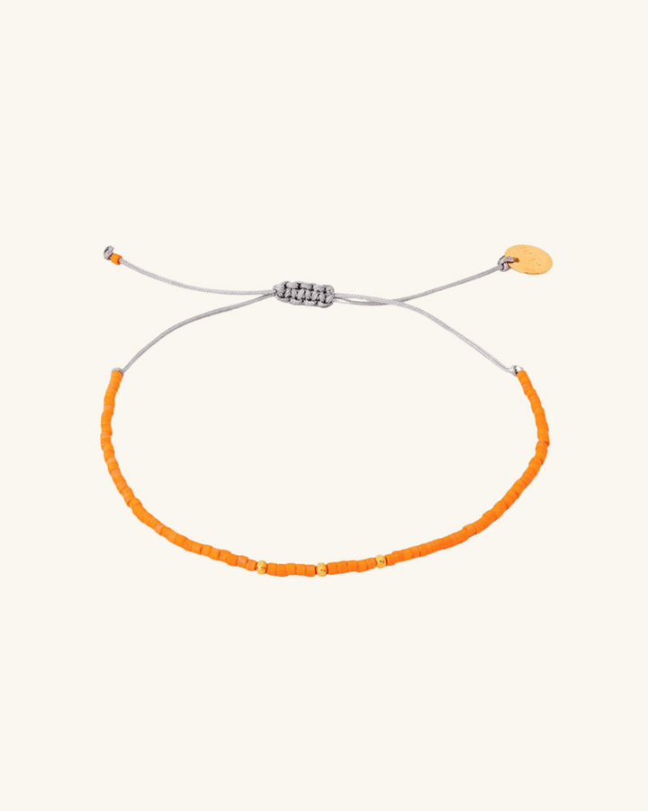 Pulsera Naranja con Mostacillas Bañadas en Oro