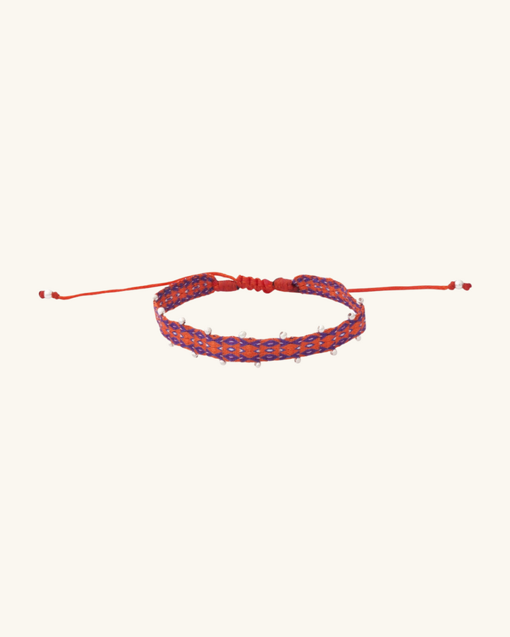 Pulsera Telar Ancha Naranja y Morado con Mostacillas de Plata al Lado