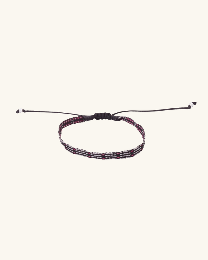 Pulsera Telar Fina Rayada Negra y Blanco con Puntos Fucsia